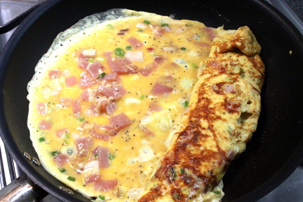 Schnell gemachtes Frühstücks Omelette mit Fuego